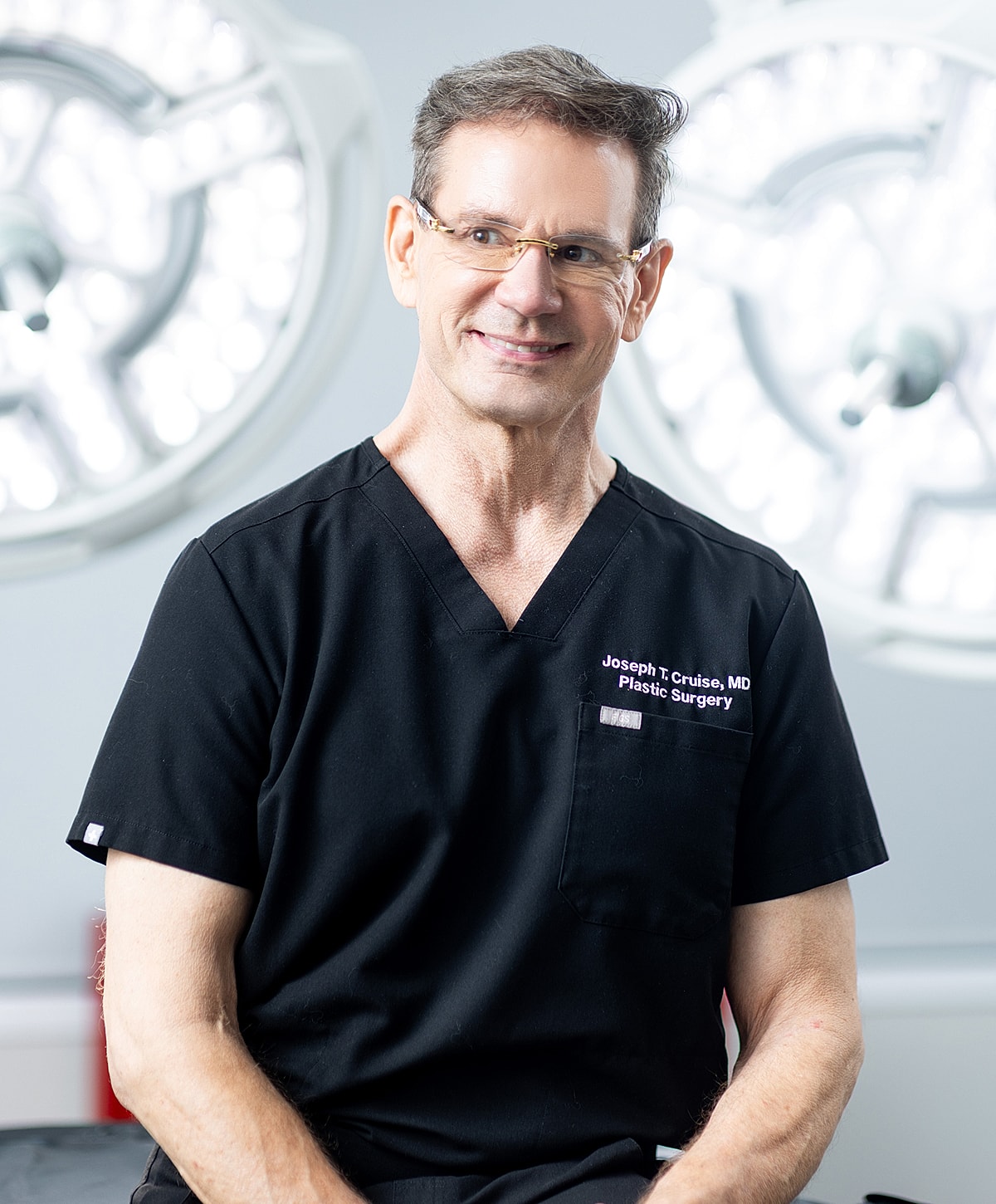 Portrait of an Orange County plastic surgeon in medical attire.