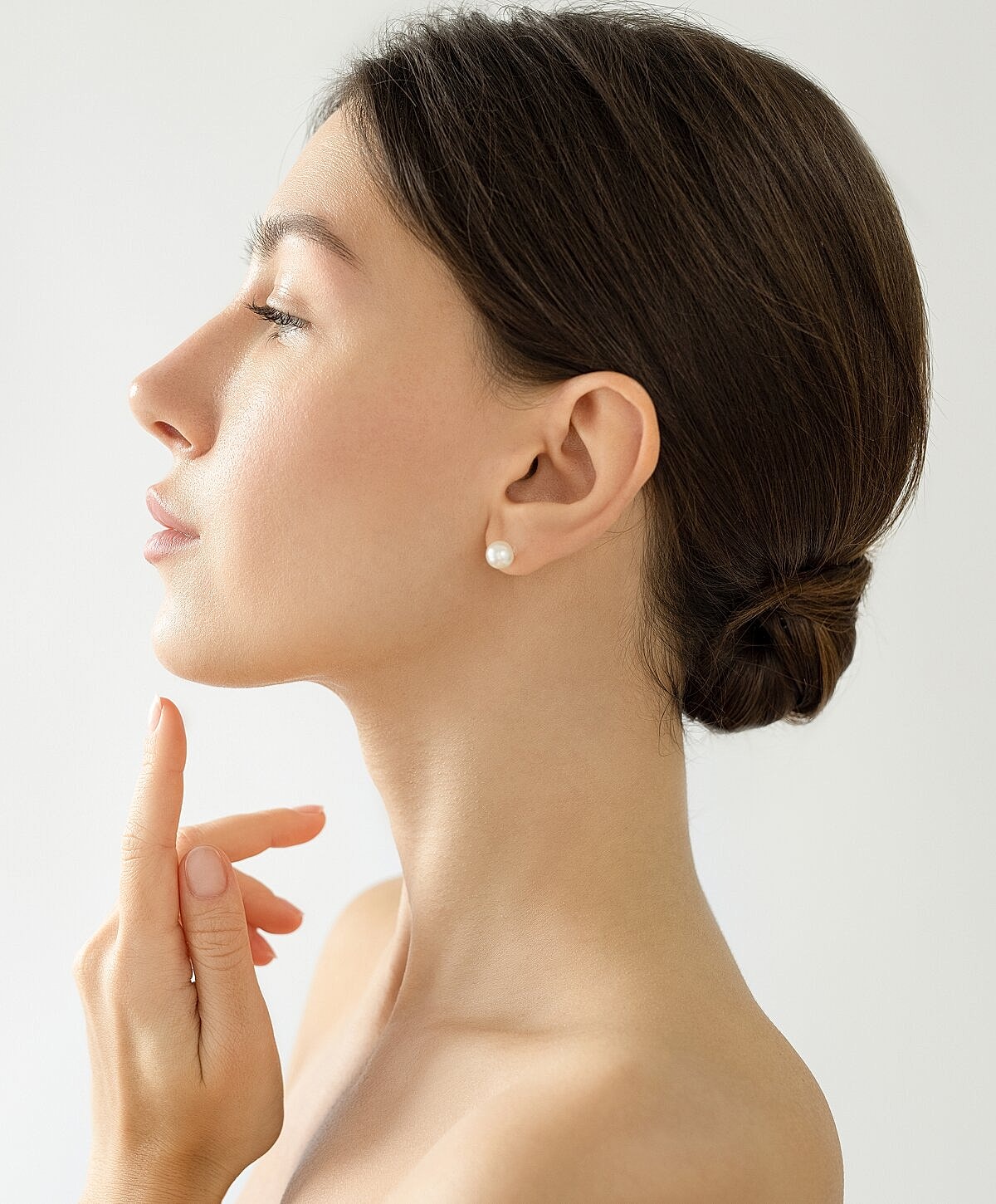 Orange County otoplasty model with elegant hairstyle.