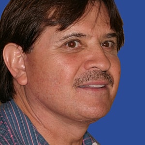 Man's profile with a blue background.