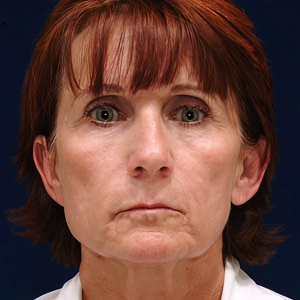 Profile of a woman against blue background.