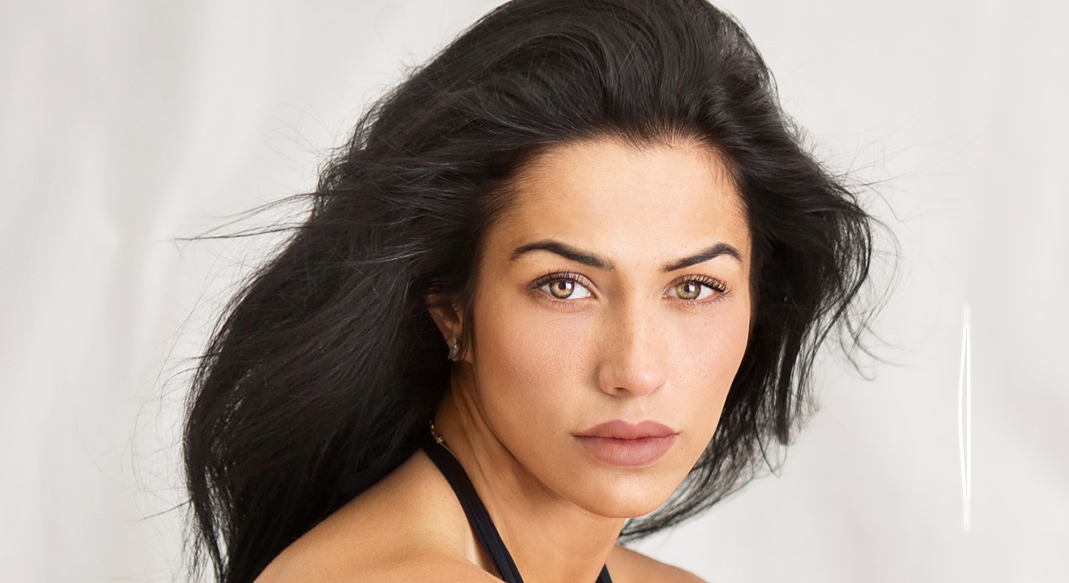 Orange County mid face lift model with flowing hair.