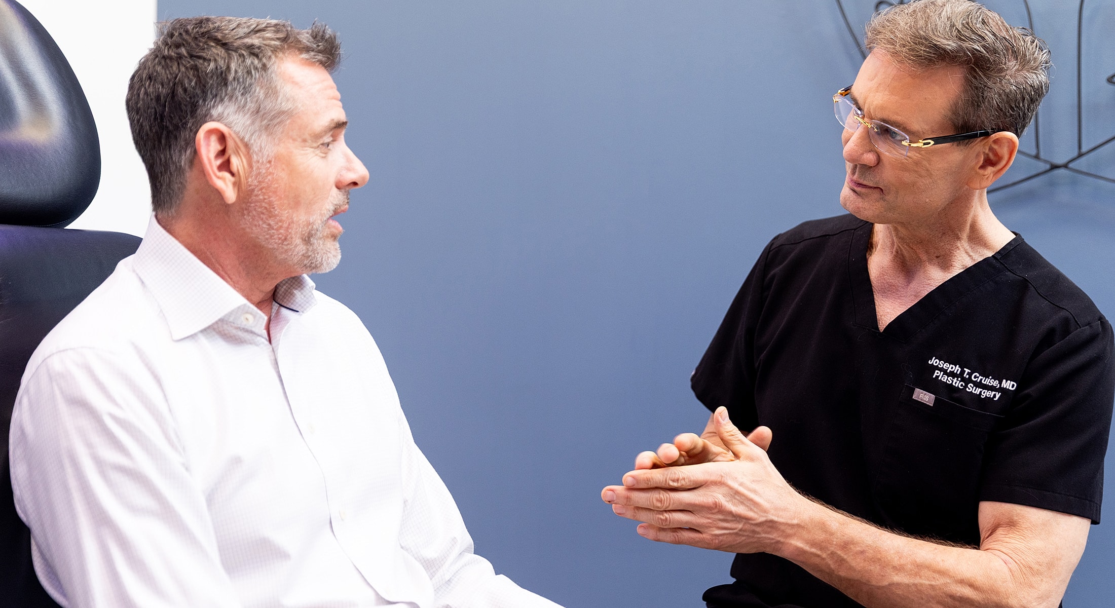 Orange County doctor consulting with patient about male facelift options.