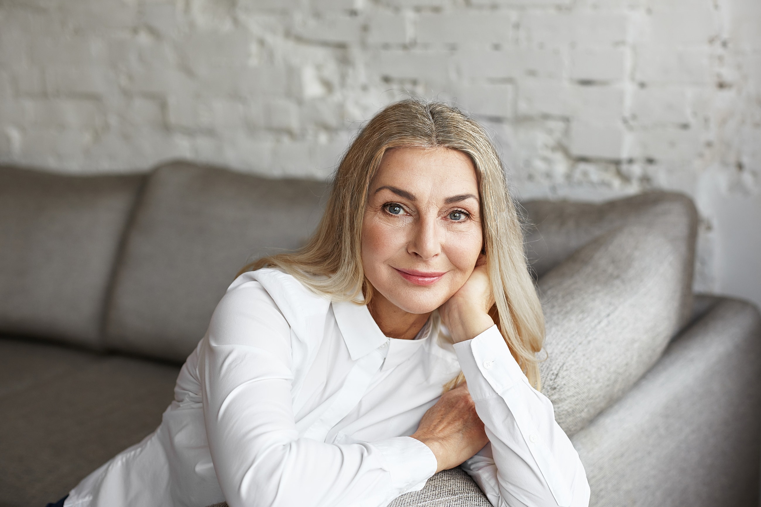 Orange County Upper Face Rejuvenation model with flowing hair against a light background.